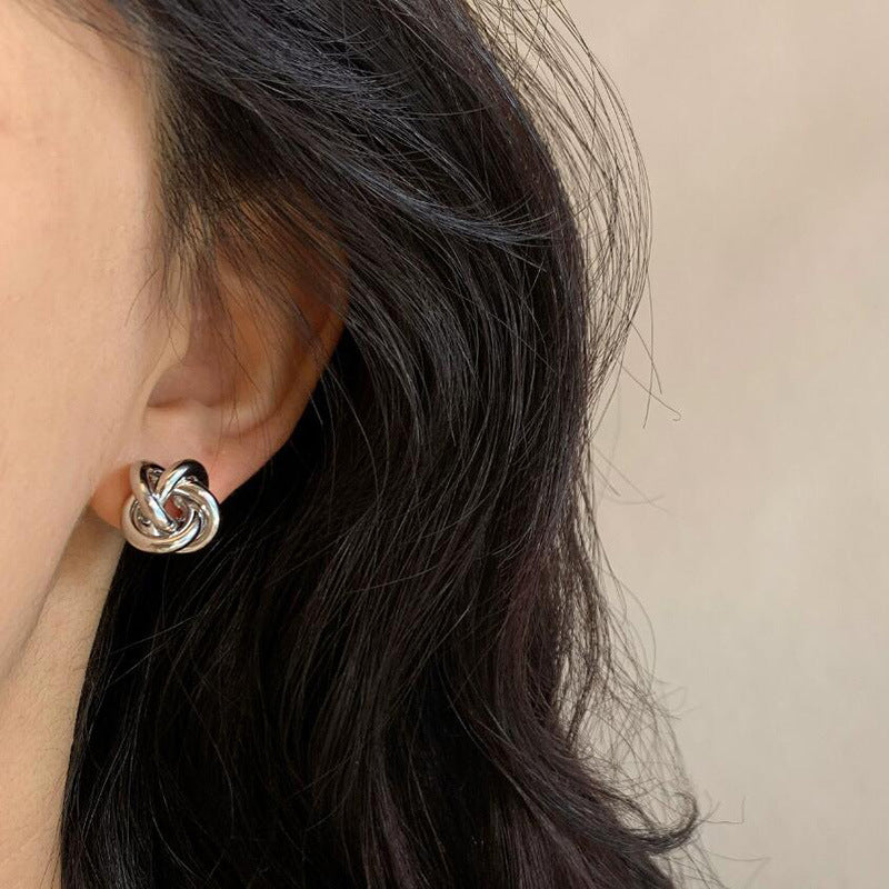Winding twist Japanese and Korean simple design stud earrings niche versatile hollow earrings metal kink cold wind women's earrings