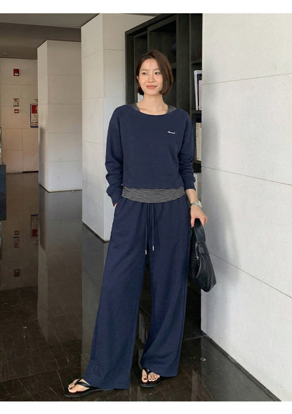 Casual sweater + striped vest + trousers