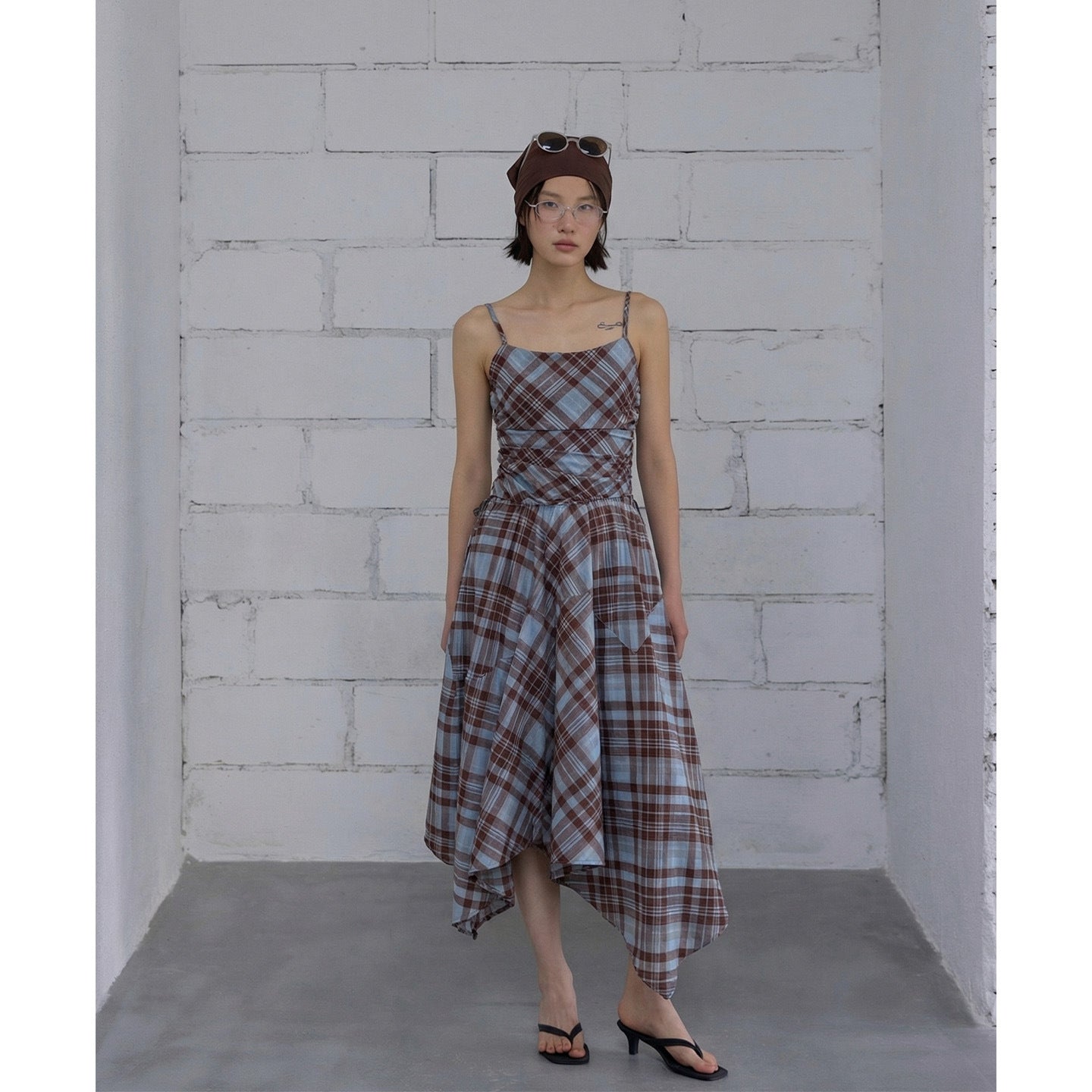 Irregularly deconstructed plaid suspender dress