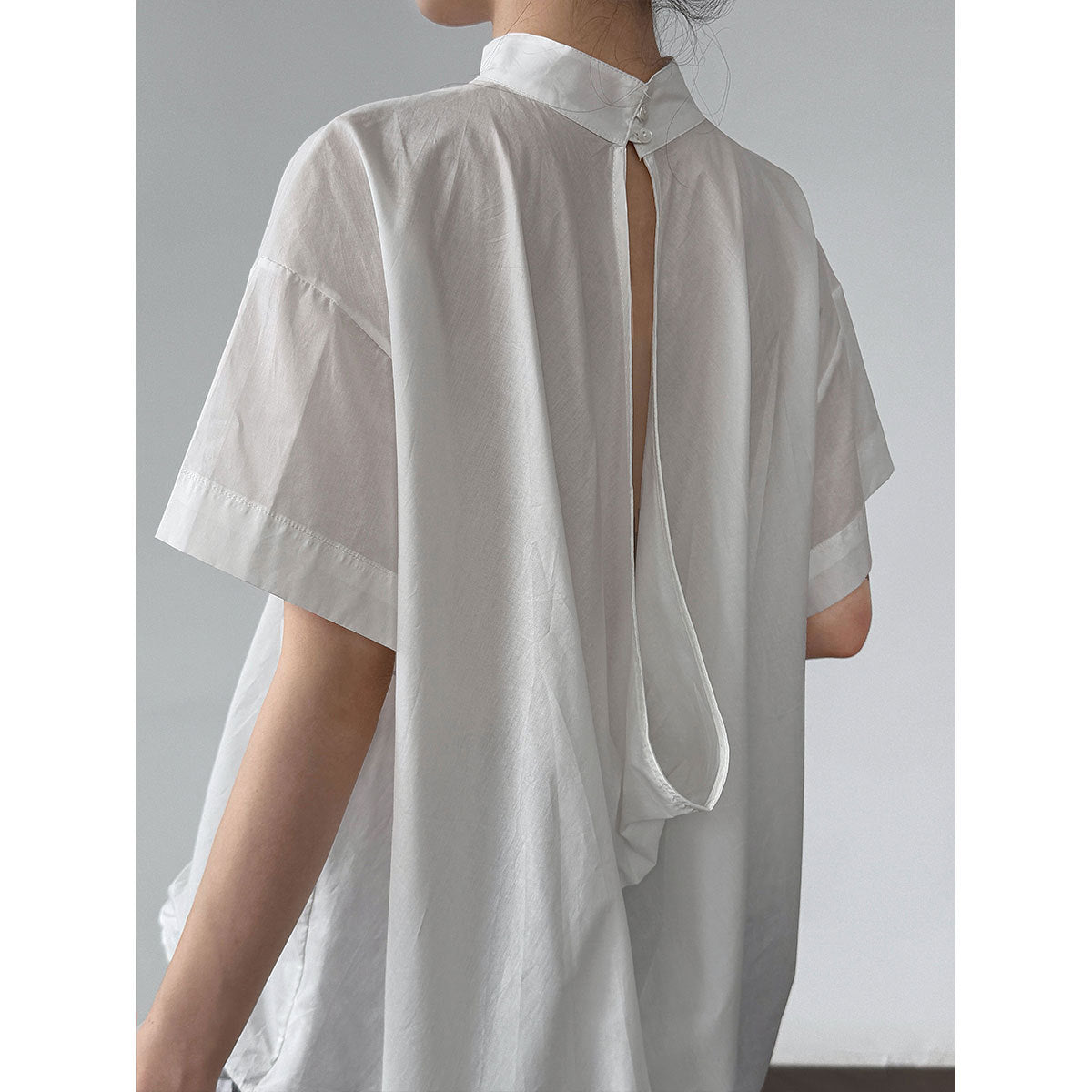 Korean-inspired, niche design blouse with a cutout back. new summer lightweight stand collar short-sleeve shirt for women