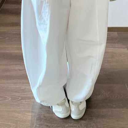 Minimalist white scimitar slacks