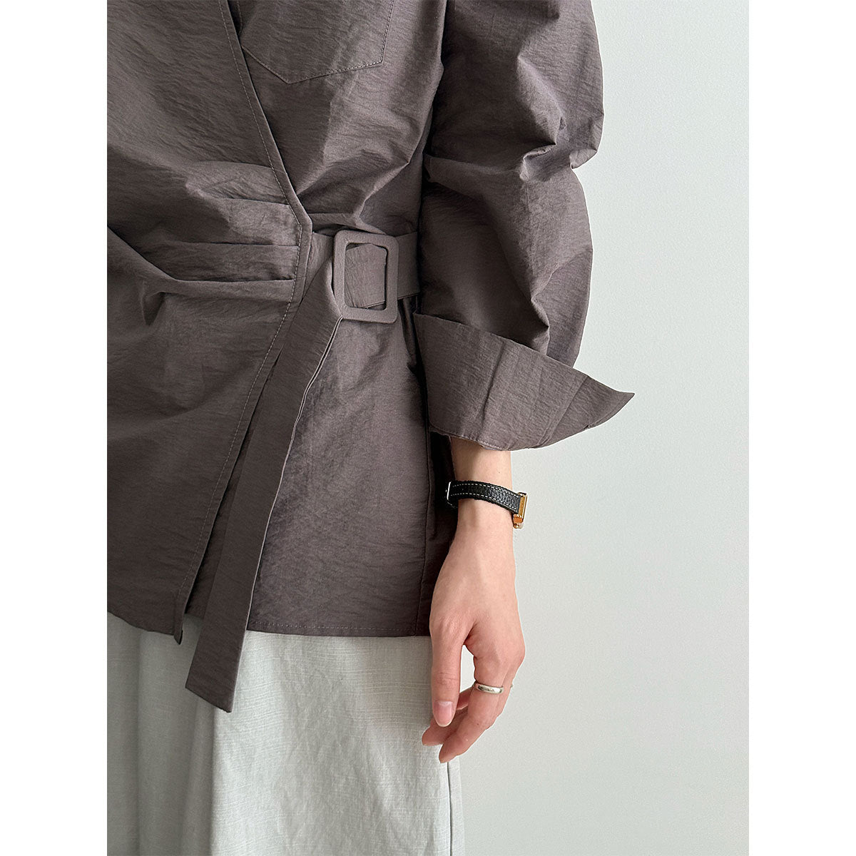 French design sense irregular cross strap shirt women's autumn new niche pleated top