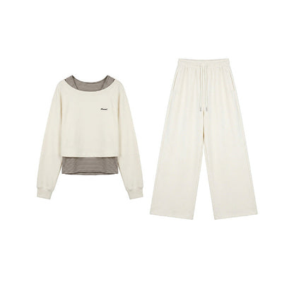 Casual sweater + striped vest + trousers