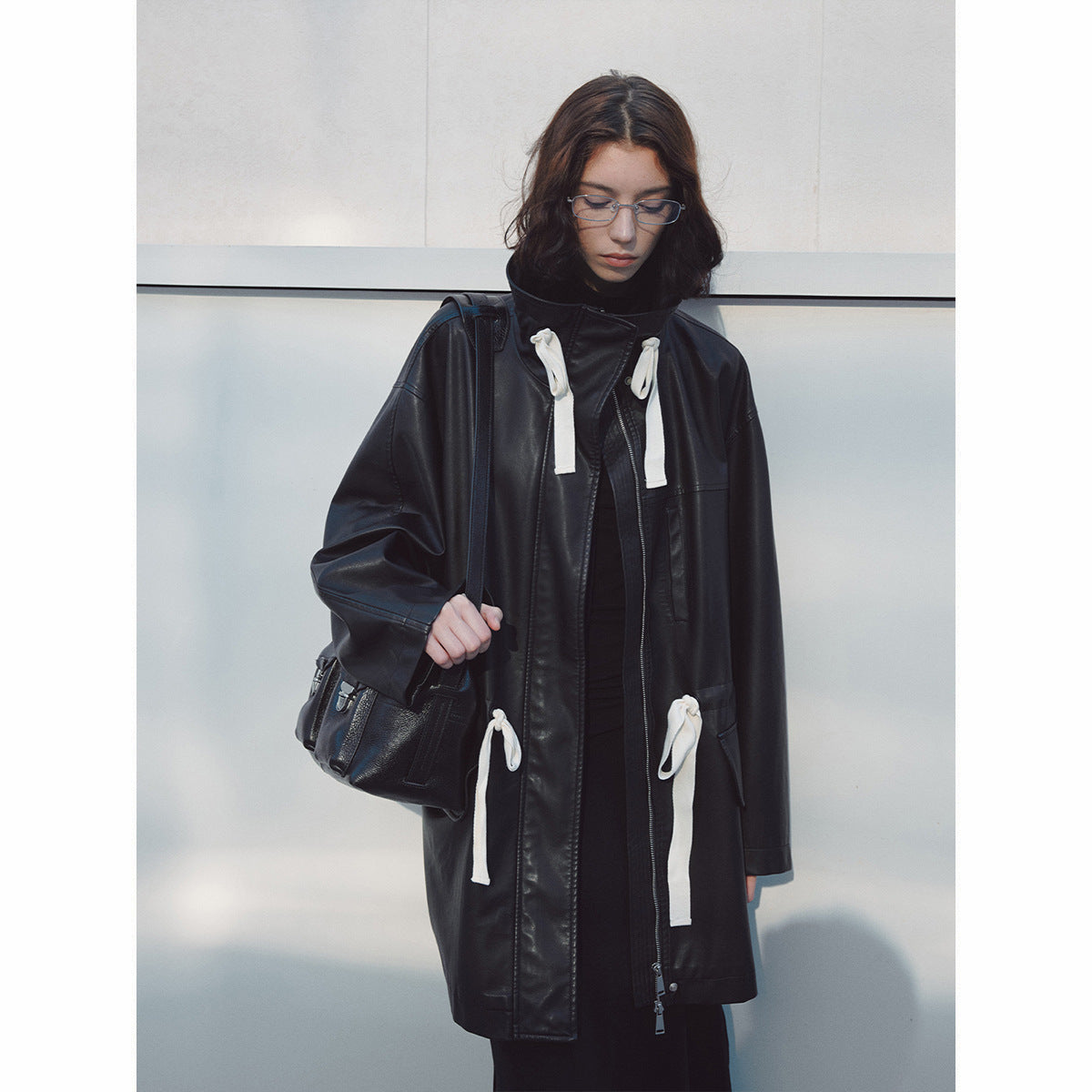 Stand-up collar streamer waist PU leather jacket, early spring new loose long commuter textured jacket