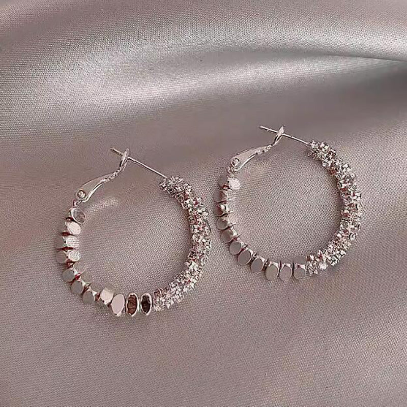 Broken silver unique circle earrings women's niche light luxury design ear buckle 2024 new popular high-end earrings