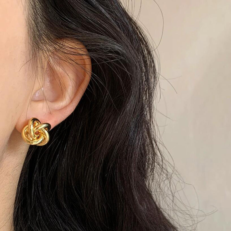 Winding twist Japanese and Korean simple design stud earrings niche versatile hollow earrings metal kink cold wind women's earrings